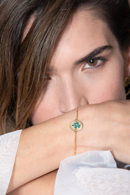 "צמיד אובל כותנה טורקיז, עם המילים "מזמנת טוב