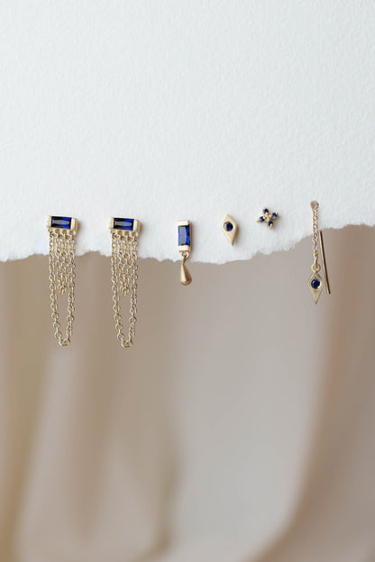 סט עגילי זהב עם אבני ספיר בעיצובים שונים ליצירת שילובים אלגנטיים ומודרניים