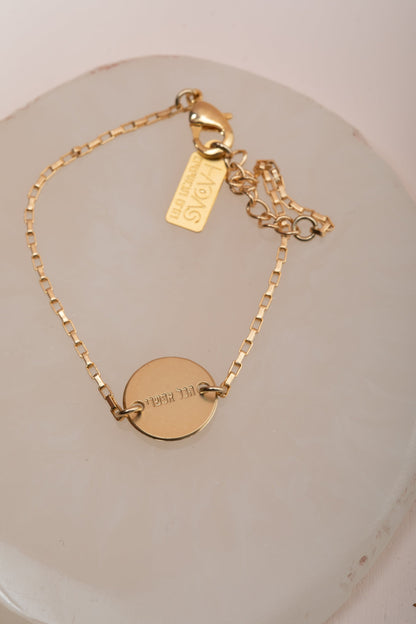 "צמיד עיגול כותנה סגול, עם המילים "הכל אפשרי